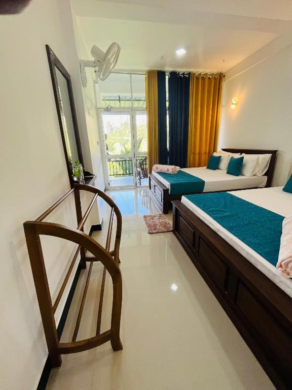 Postel nebo postele na pokoji v ubytování Viyanga Homestay
