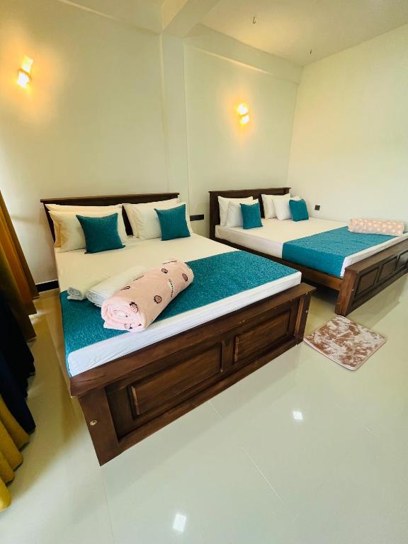Postel nebo postele na pokoji v ubytování Viyanga Homestay