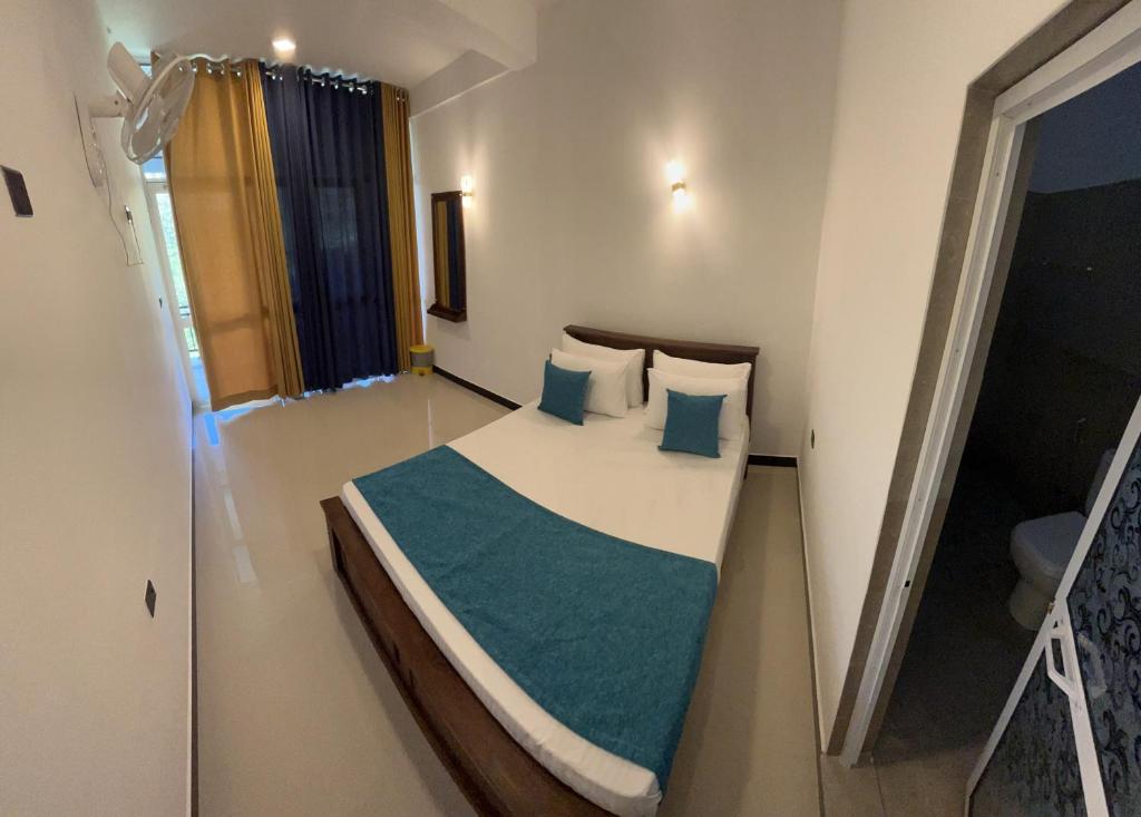 Postel nebo postele na pokoji v ubytování Viyanga Homestay