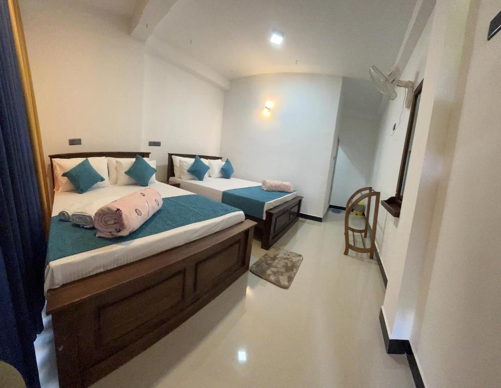 Postel nebo postele na pokoji v ubytování Viyanga Homestay
