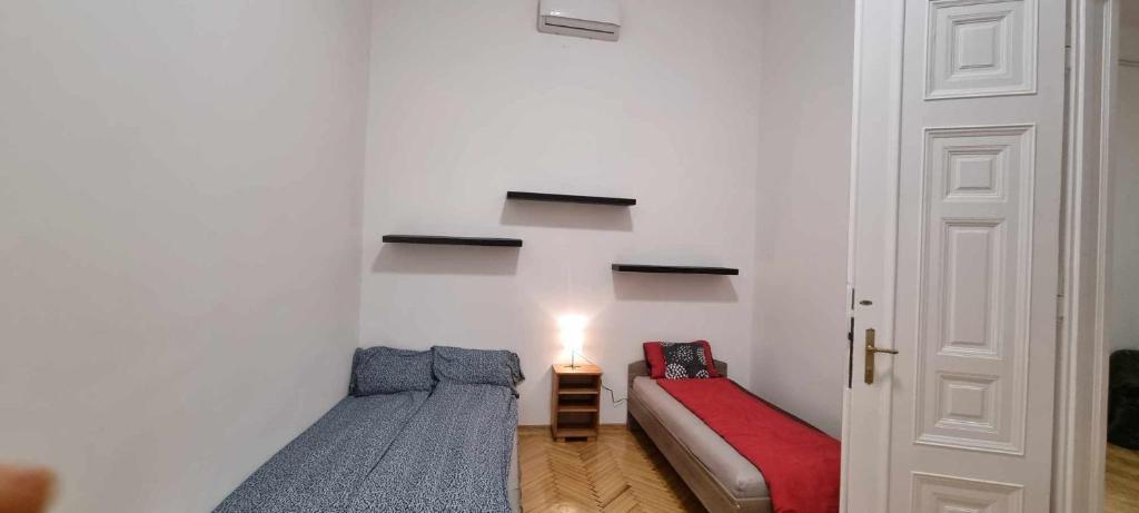 Postel nebo postele na pokoji v ubytování Universal Apartment Budapest