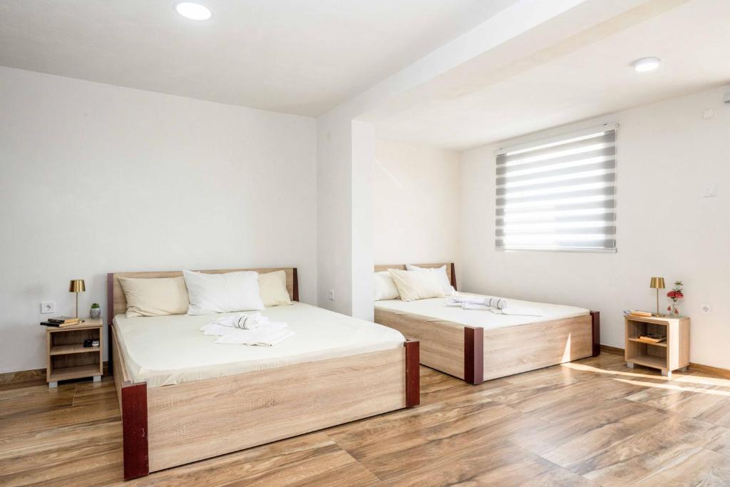 Postel nebo postele na pokoji v ubytování Sumice Inn