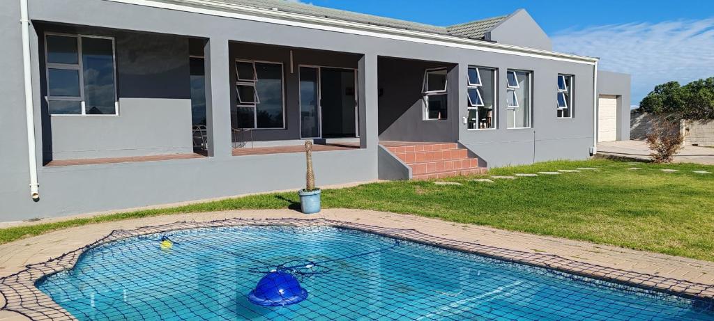 a house with a swimming pool in the yard at Klipvis at Duykereiland in St Helena Bay