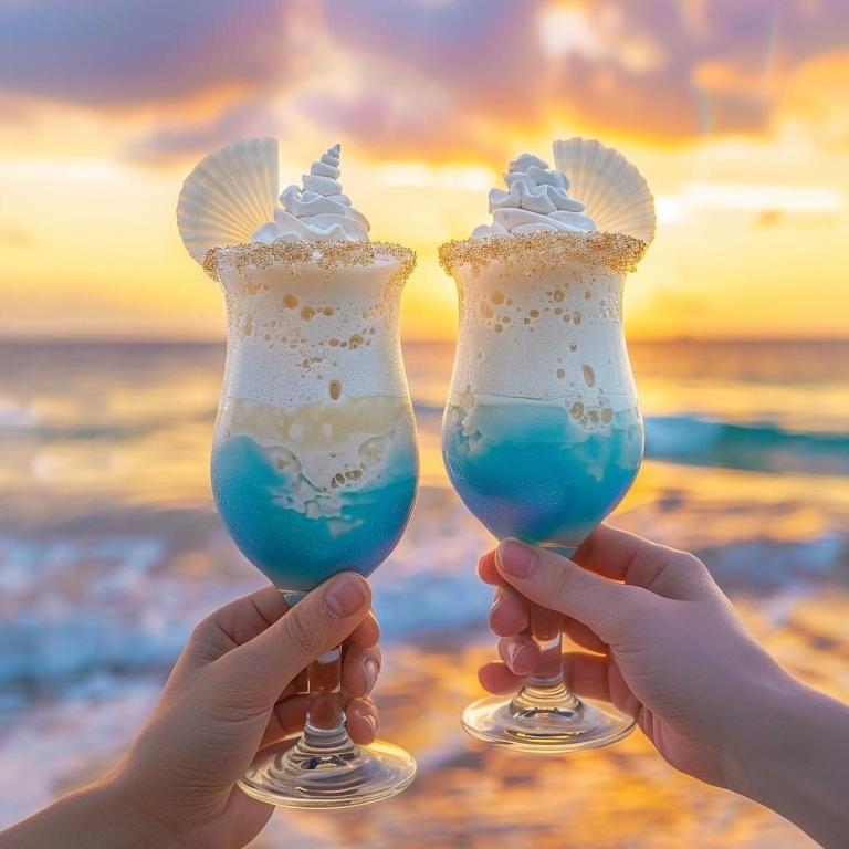 two hands holding two glasses with whipped cream at Charming 2-bed flat with pool view in Sunny Beach, Bulgaria in Sunny Beach