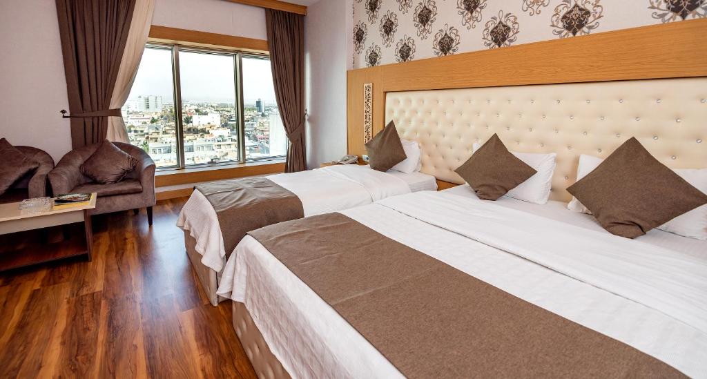 Postel nebo postele na pokoji v ubytování Classy Hotel Erbil