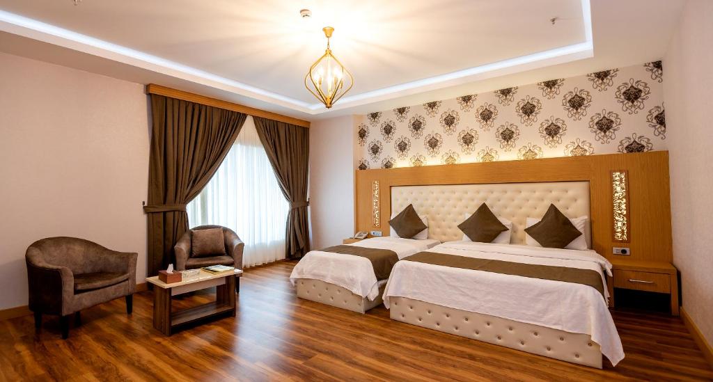 Postel nebo postele na pokoji v ubytování Classy Hotel Erbil