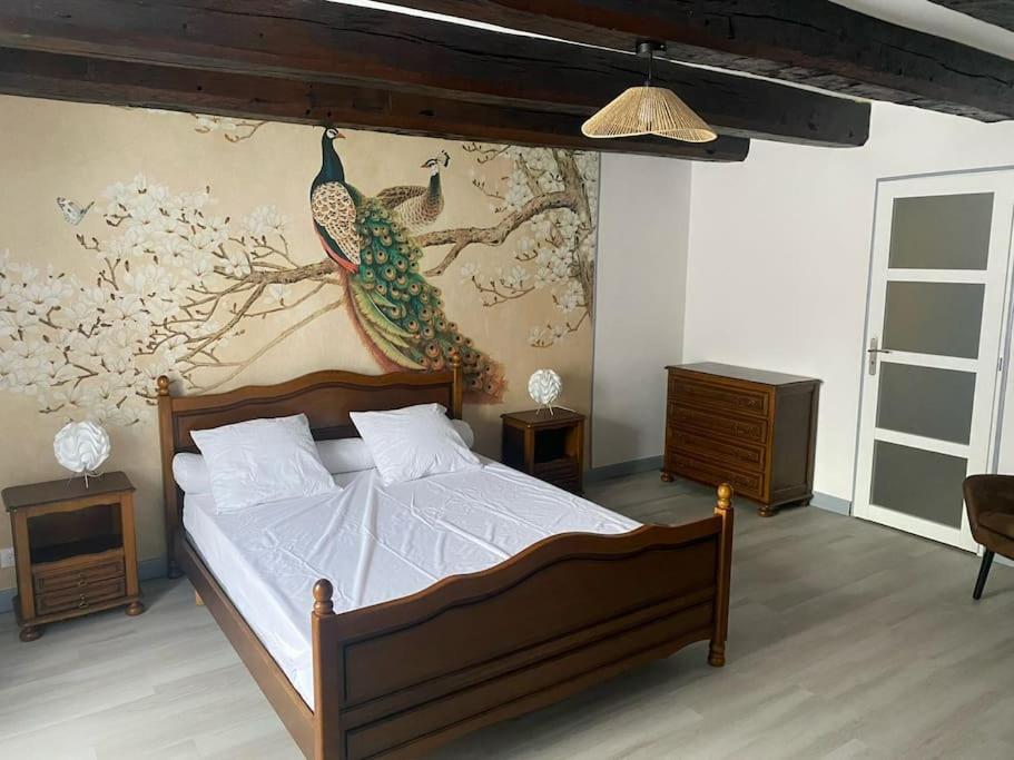 Postel nebo postele na pokoji v ubytování Gîte le temps de vivre