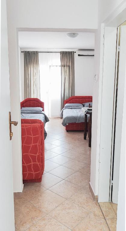 Postel nebo postele na pokoji v ubytování Zlatni Pijesak - Apartmani Čanj