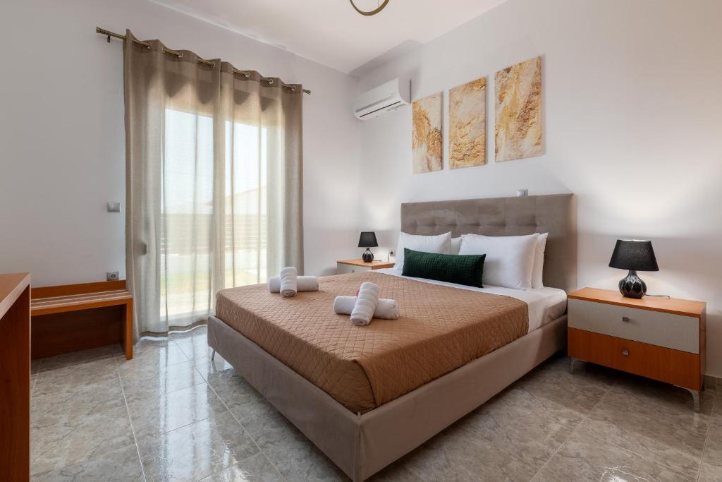 Postel nebo postele na pokoji v ubytování Elysian Villa