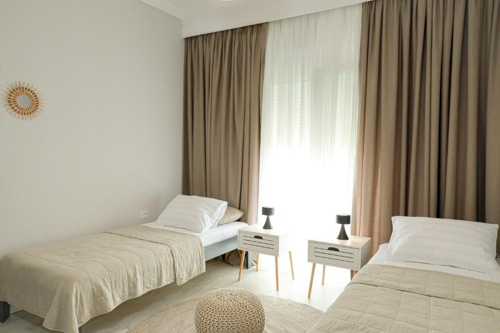 Postel nebo postele na pokoji v ubytování Freya Apartments