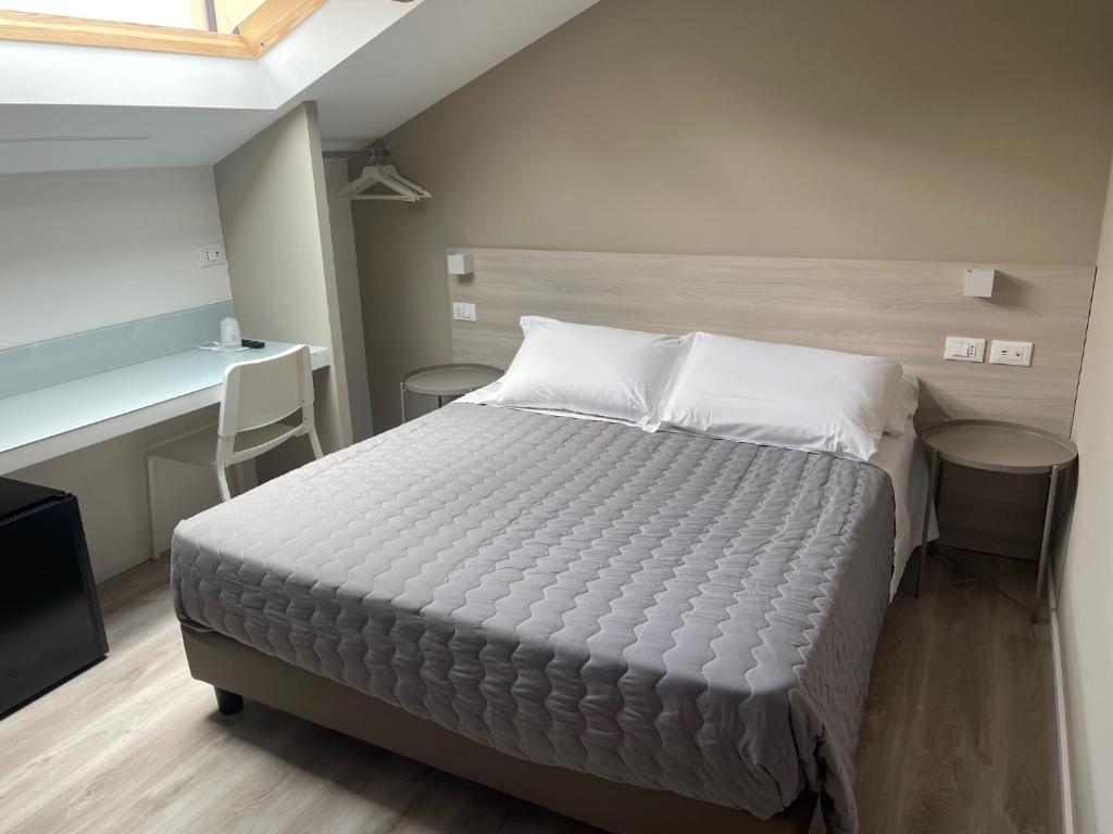Postel nebo postele na pokoji v ubytování Hotel Principe