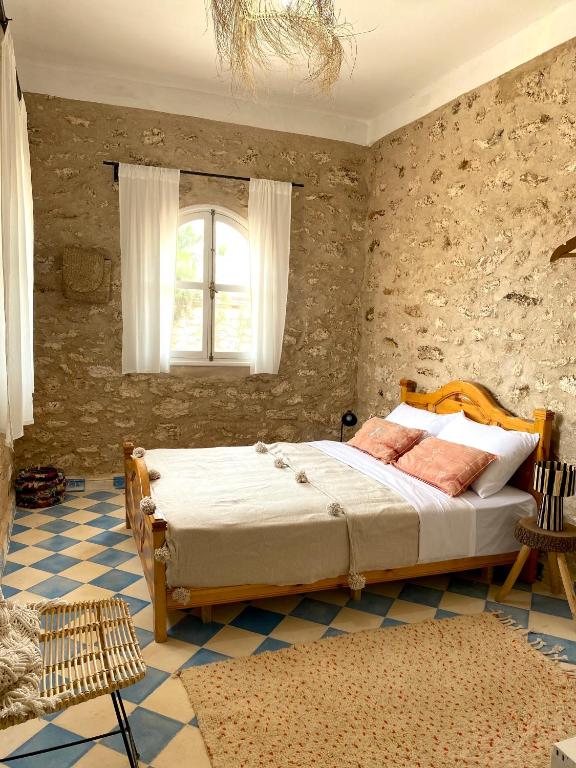 Postel nebo postele na pokoji v ubytování Adam house