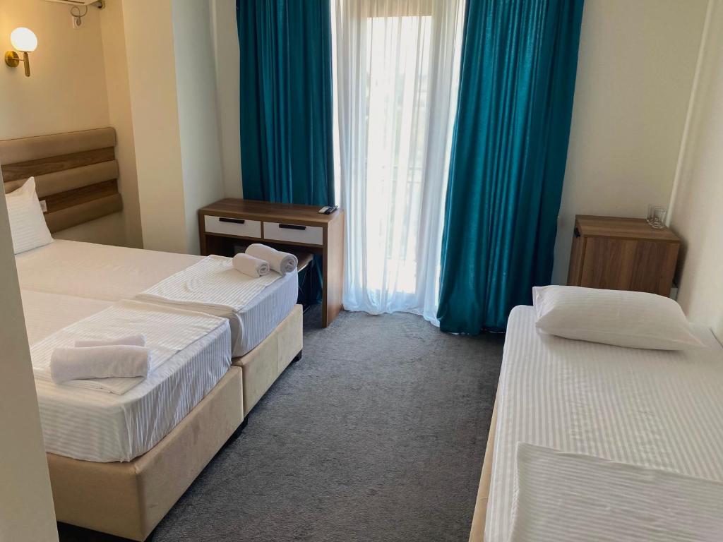 Postel nebo postele na pokoji v ubytování Royal Palace