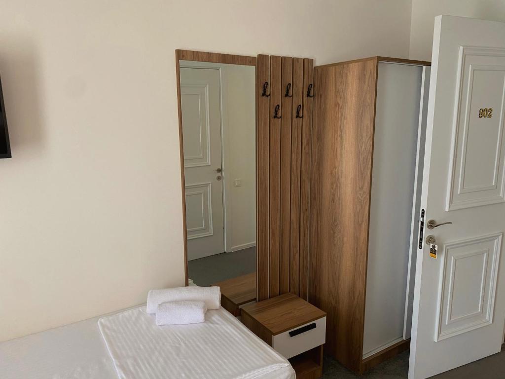 Postel nebo postele na pokoji v ubytování Royal Palace