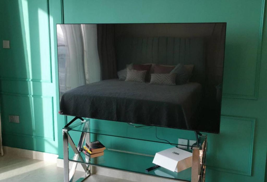 Postelja oz. postelje v sobi nastanitve Jupiter Saadiyat Beach New York Abu Dhabi university Studio Apartment