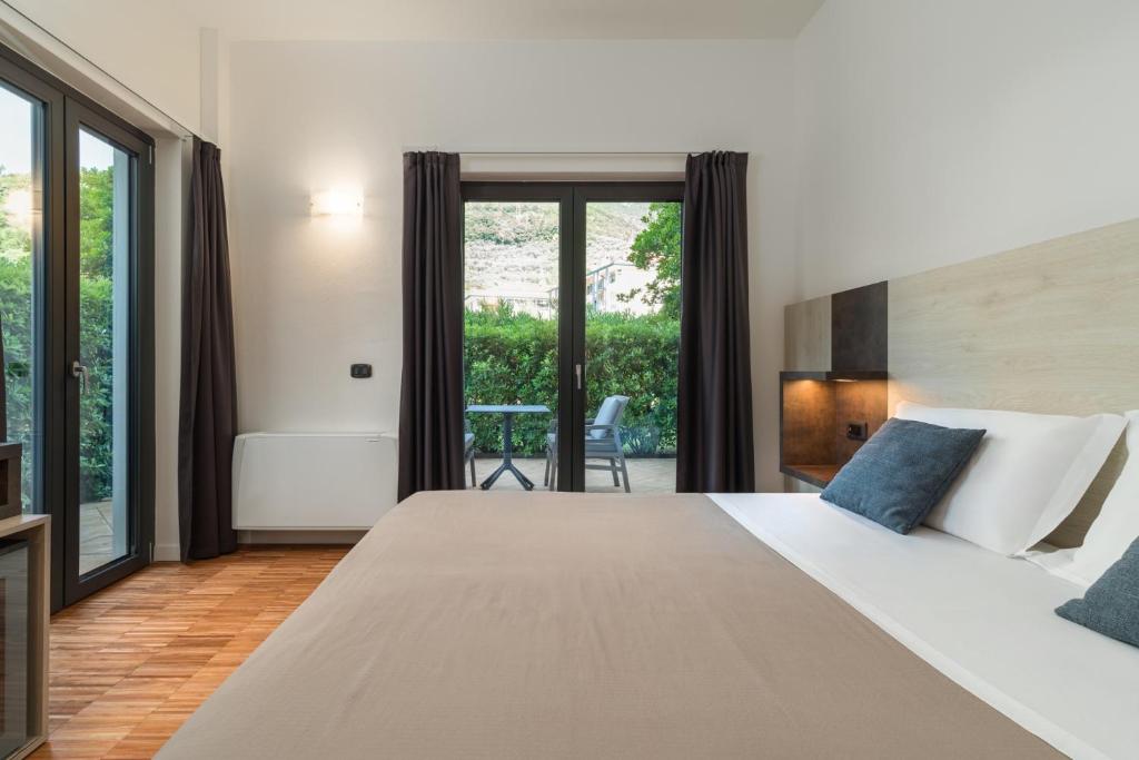 Postel nebo postele na pokoji v ubytování Residence Al Frantoio