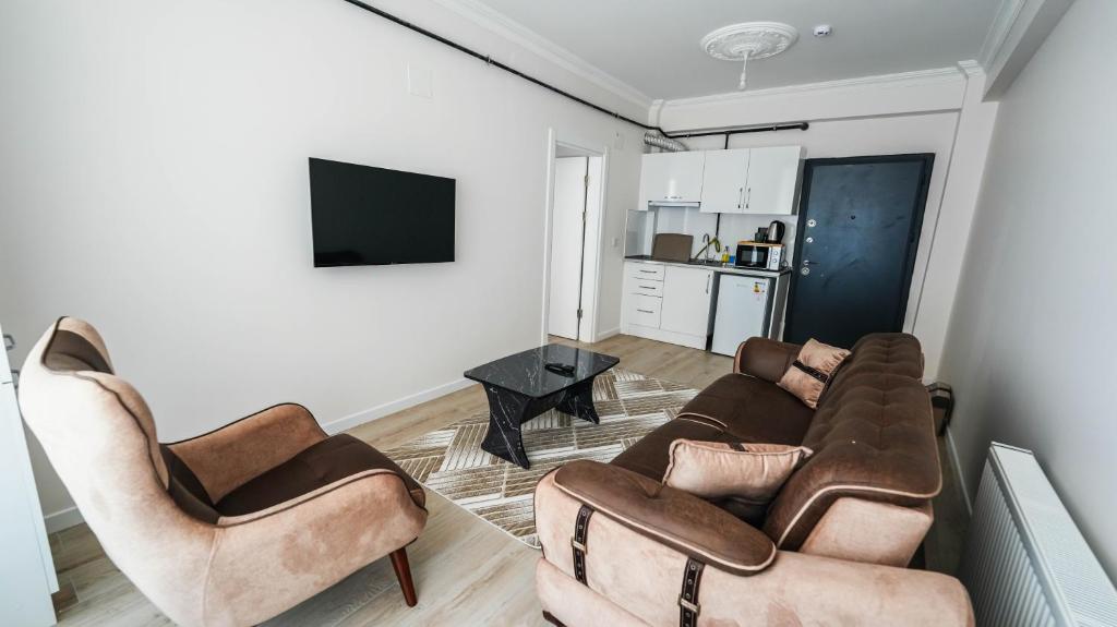 TV a/nebo společenská místnost v ubytování Cappadocia Ürgüp Apart Hotel