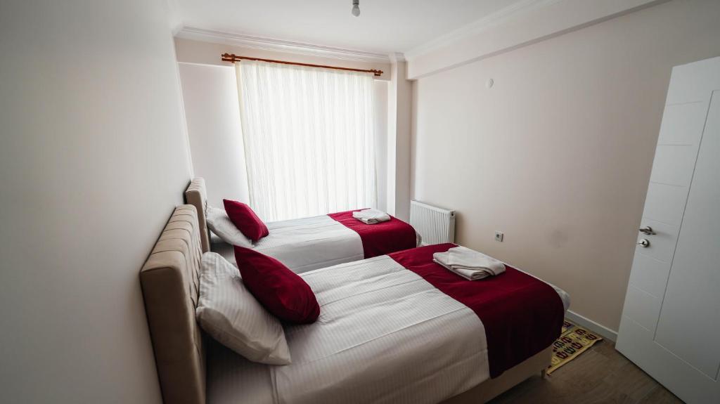 Postel nebo postele na pokoji v ubytování Cappadocia Ürgüp Apart Hotel