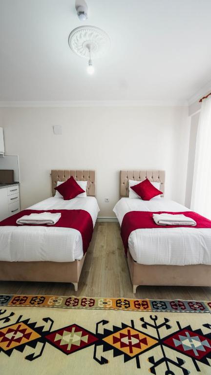 Postel nebo postele na pokoji v ubytování Cappadocia Ürgüp Apart Hotel