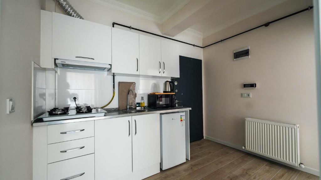 Kuchyň nebo kuchyňský kout v ubytování Cappadocia Ürgüp Apart Hotel