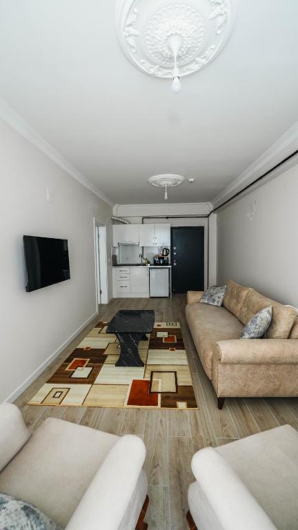 TV a/nebo společenská místnost v ubytování Cappadocia Ürgüp Apart Hotel