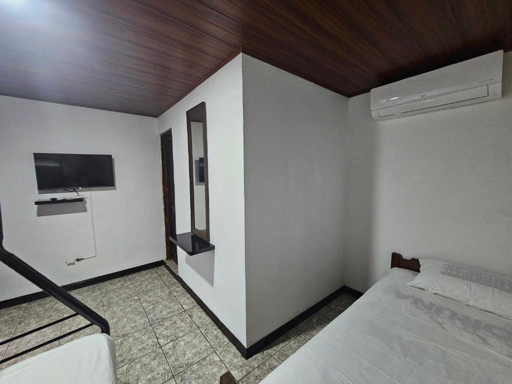 Postel nebo postele na pokoji v ubytování Hotel Luna Liberiana