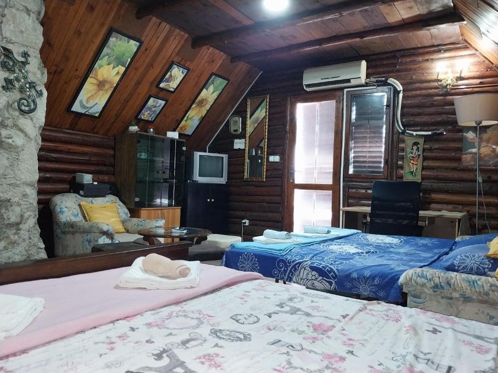 Postel nebo postele na pokoji v ubytování Vikend kuća Nikolić