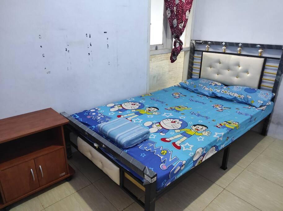 Ένα ή περισσότερα κρεβάτια σε δωμάτιο στο B&B Guest House