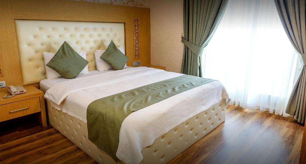 Postel nebo postele na pokoji v ubytování Classy Hotel Erbil