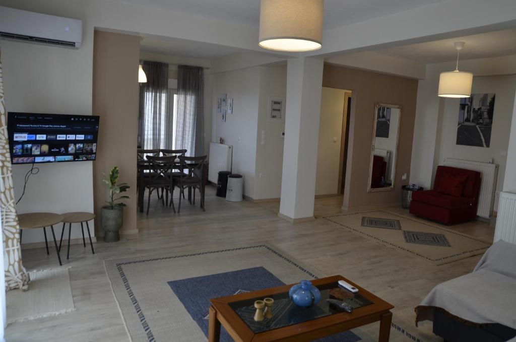 a living room with a couch and a table at Irida Home in Ioannina