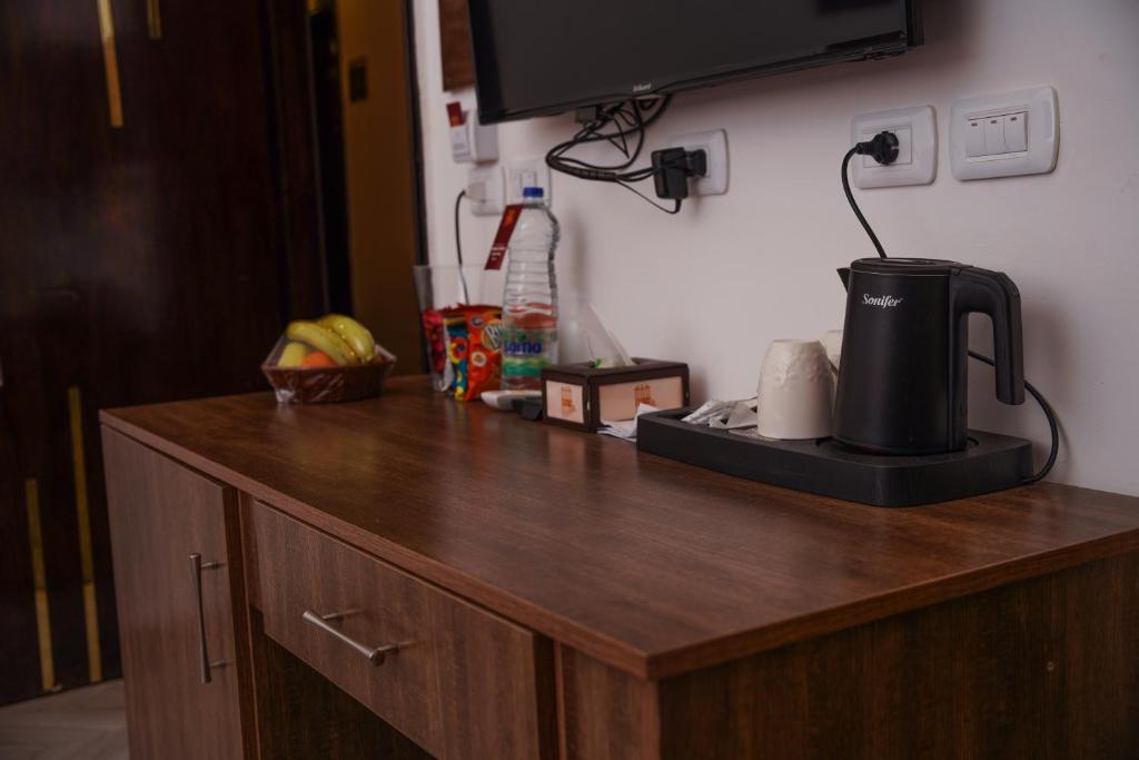 Kuchyň nebo kuchyňský kout v ubytování Petra Corner Hotel