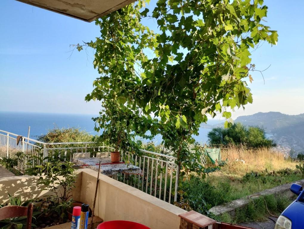 a view of the ocean from the balcony of a house at Don Vladi in Letojanni