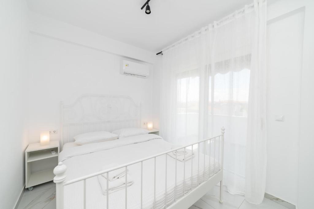 Postel nebo postele na pokoji v ubytování Anastasia Residential Complex