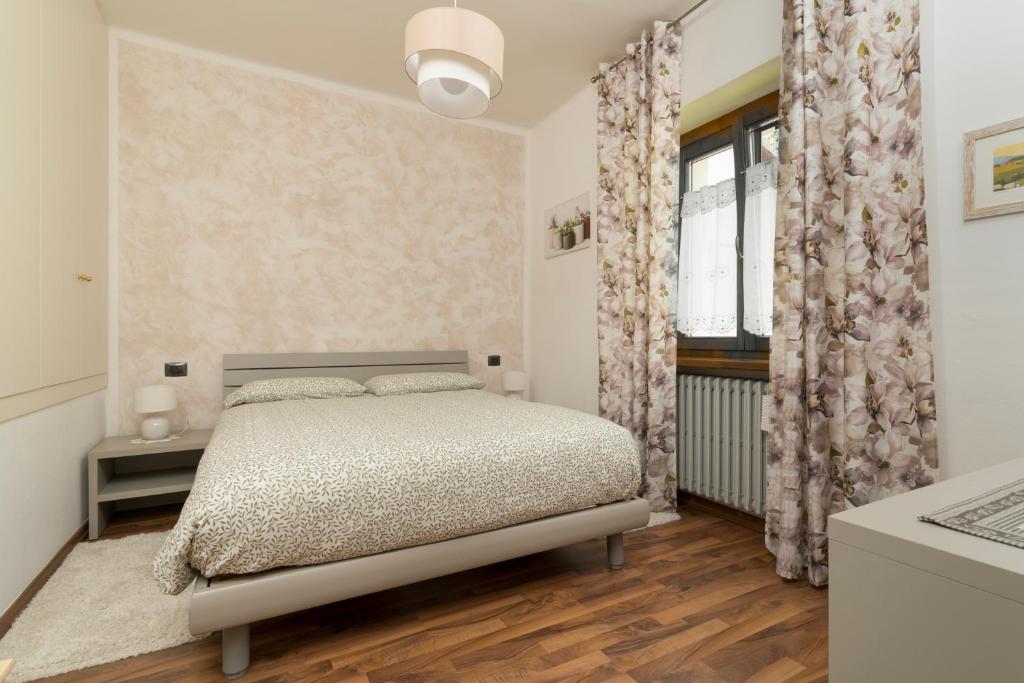 Posteľ alebo postele v izbe v ubytovaní Rosmary42 Miralago