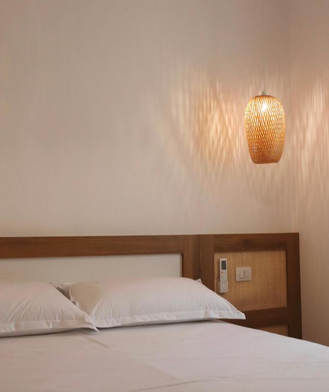 Postel nebo postele na pokoji v ubytování NOIMA Hotel & Suites