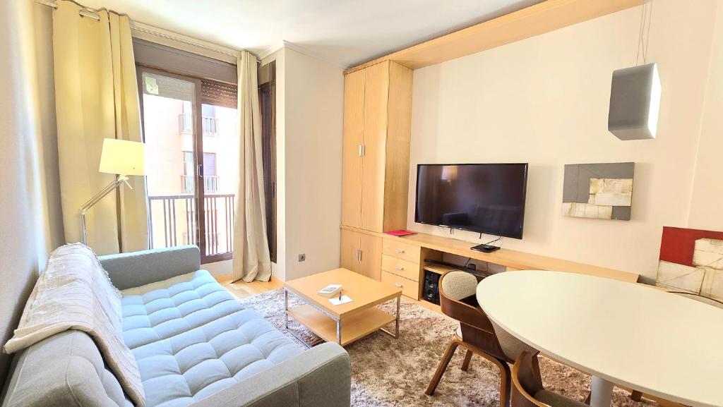 a living room with a couch and a table at campezo in Madrid