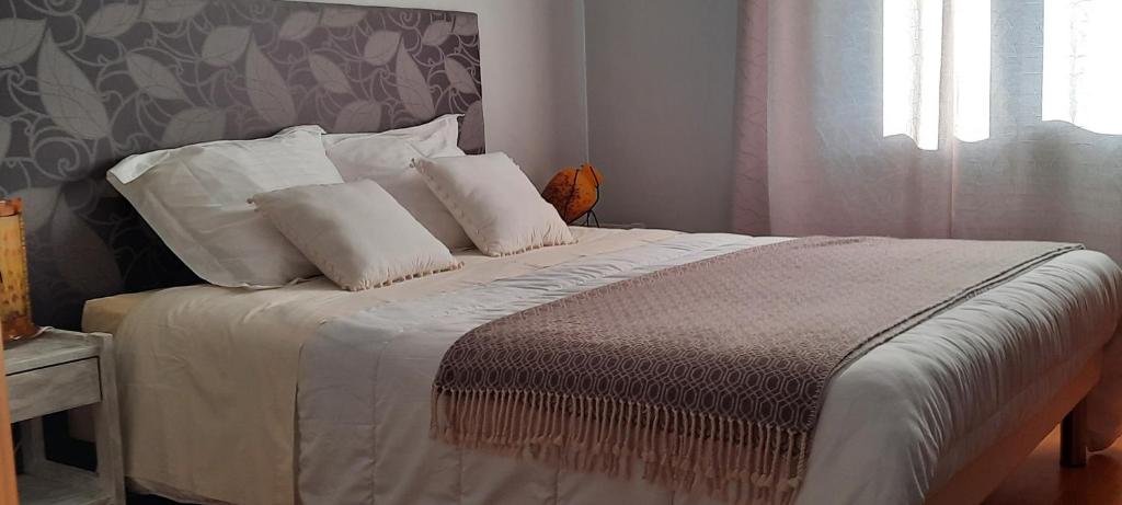 Postel nebo postele na pokoji v ubytování Chambres d'hôtes Chez Dumitra
