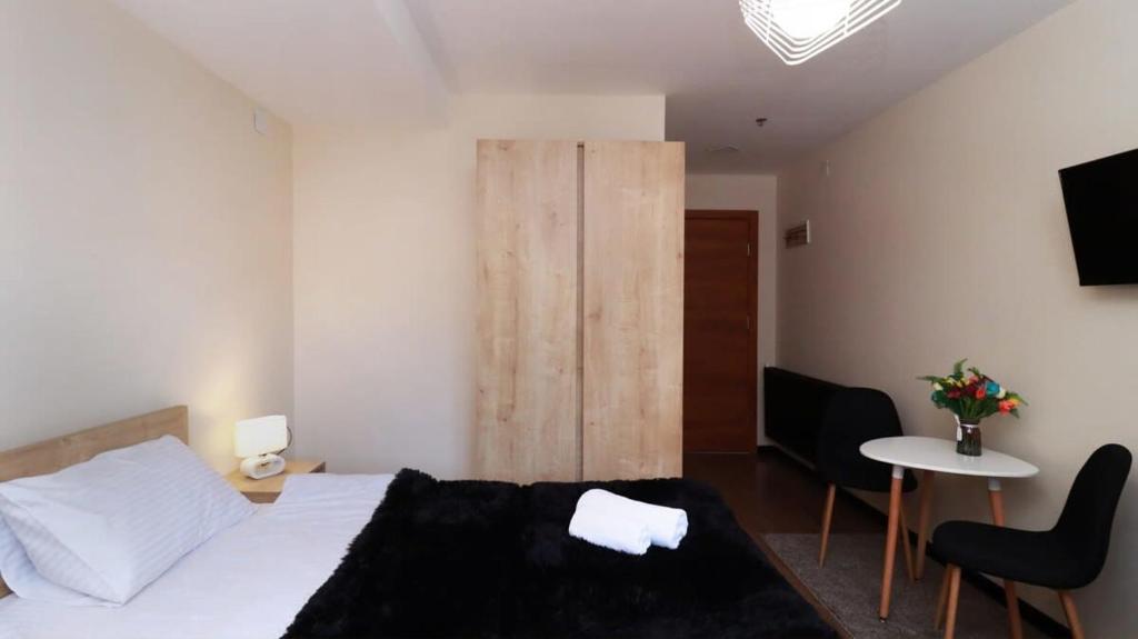 Postel nebo postele na pokoji v ubytování Apartment in Marshall Gudauri Project