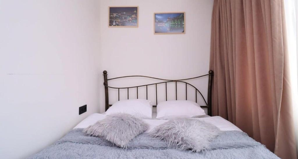 Postel nebo postele na pokoji v ubytování Bright Apartment in Marshall Gudauri