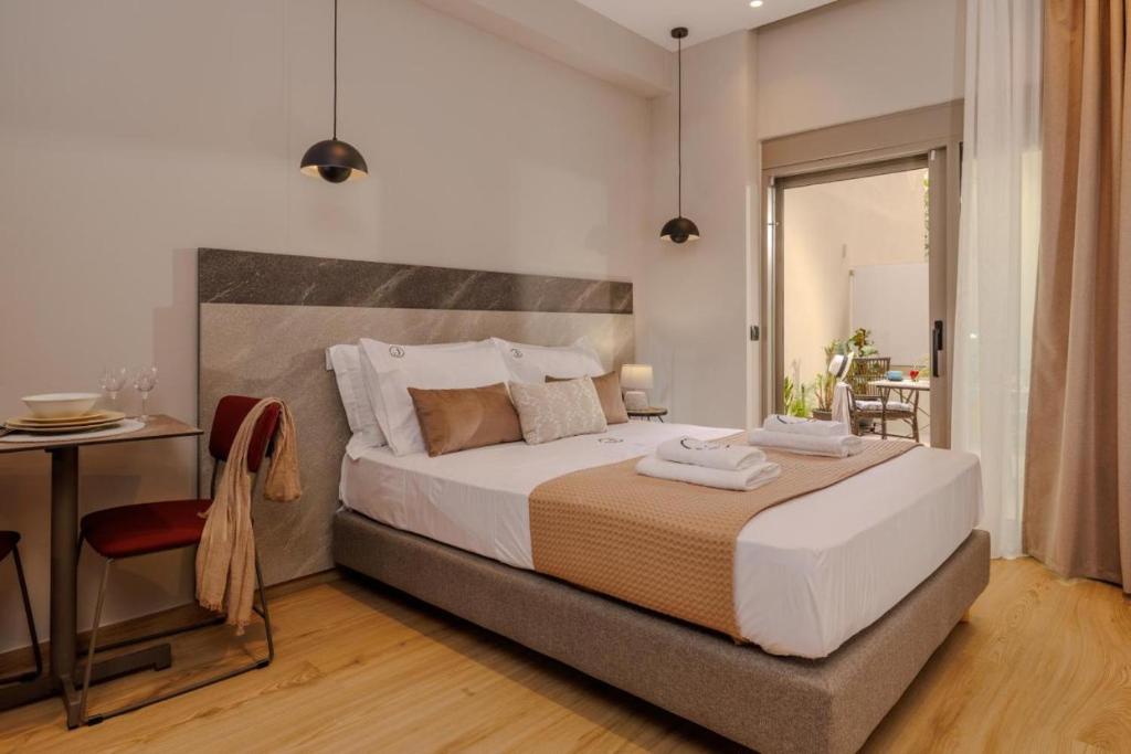 Postel nebo postele na pokoji v ubytování Jolly Suites