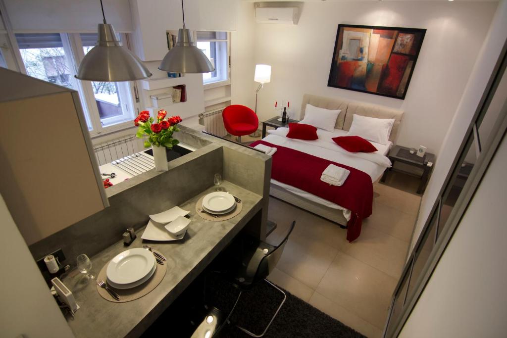 Studio Apartment Picasso में एक कमरे में एक या कई बेड