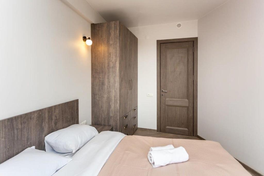Postel nebo postele na pokoji v ubytování 1BR Apartment in Twins Gudauri project