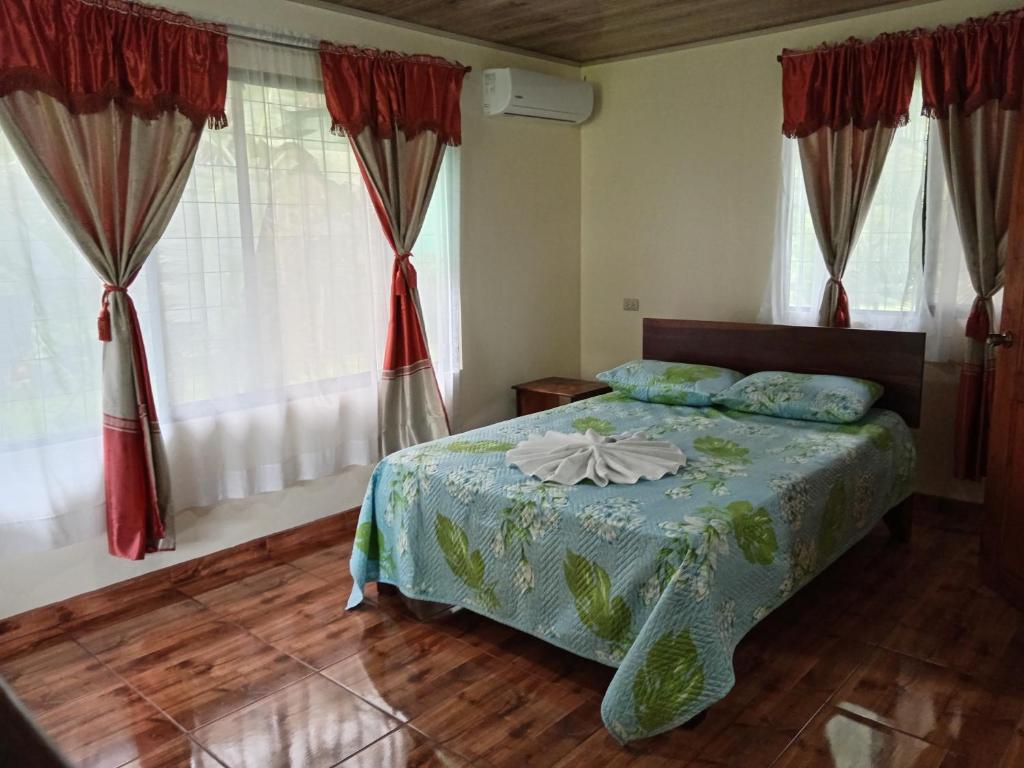 Postel nebo postele na pokoji v ubytování Posada Rural Río Celeste
