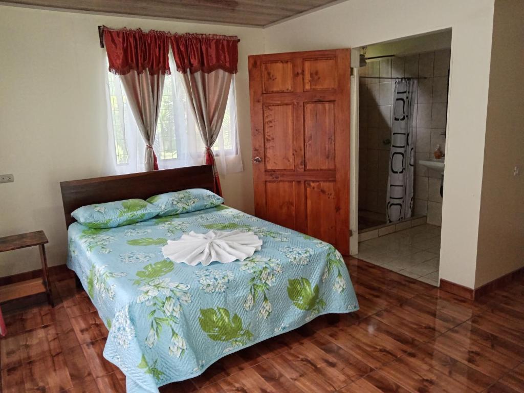 Postel nebo postele na pokoji v ubytování Posada Rural Río Celeste