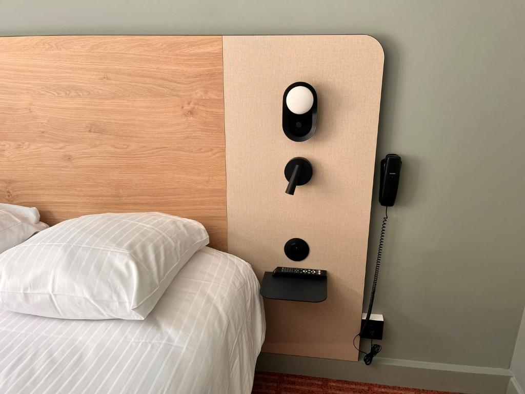 Postel nebo postele na pokoji v ubytování Hôtel L'Ours De Mutzig