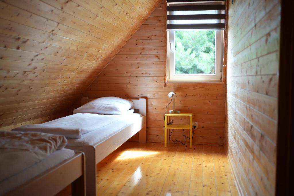 Postel nebo postele na pokoji v ubytování Domki Ptasie Radio