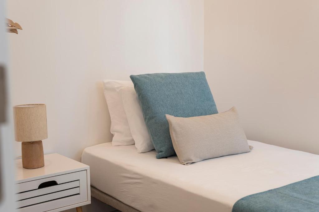 Postel nebo postele na pokoji v ubytování Madalena Hostel e Suites