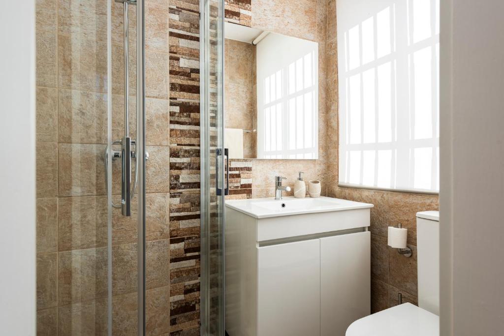 Koupelna v ubytování Madalena Hostel e Suites