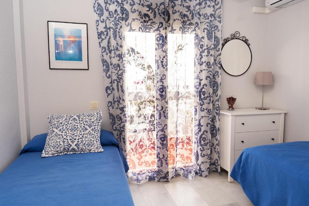 Łóżko lub łóżka w pokoju w obiekcie Casa la Buganvilla-Mojácar Playa