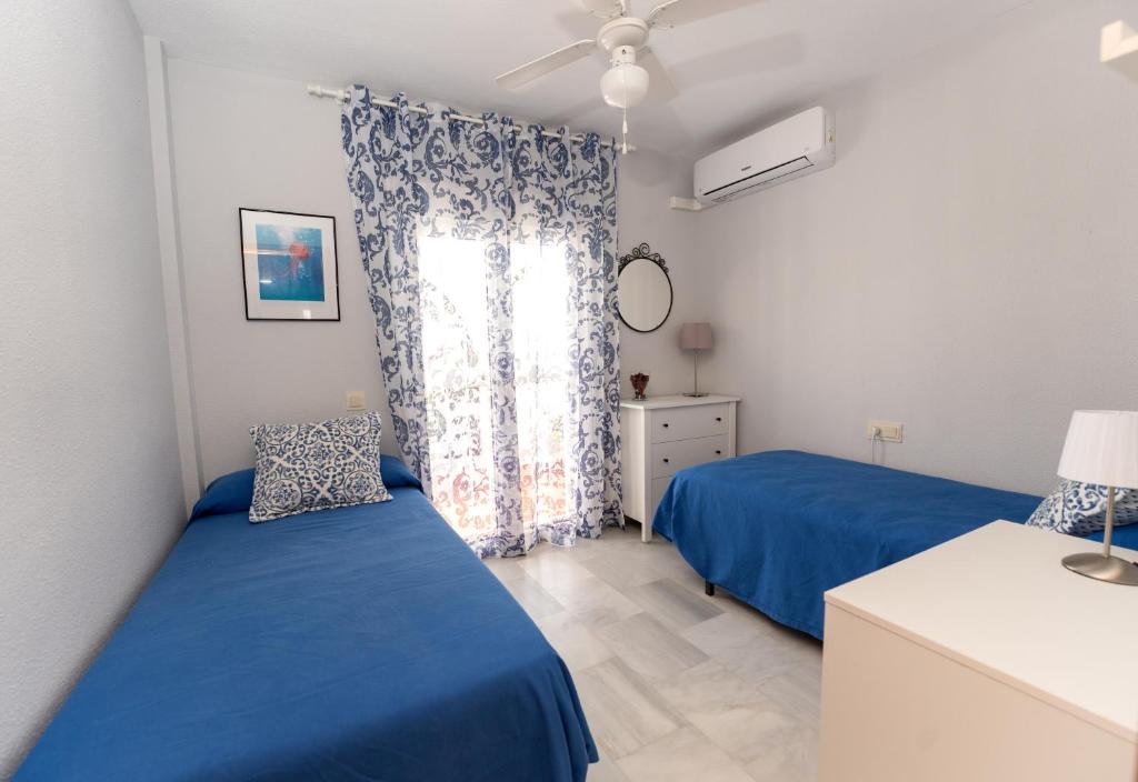 Łóżko lub łóżka w pokoju w obiekcie Casa la Buganvilla-Mojácar Playa